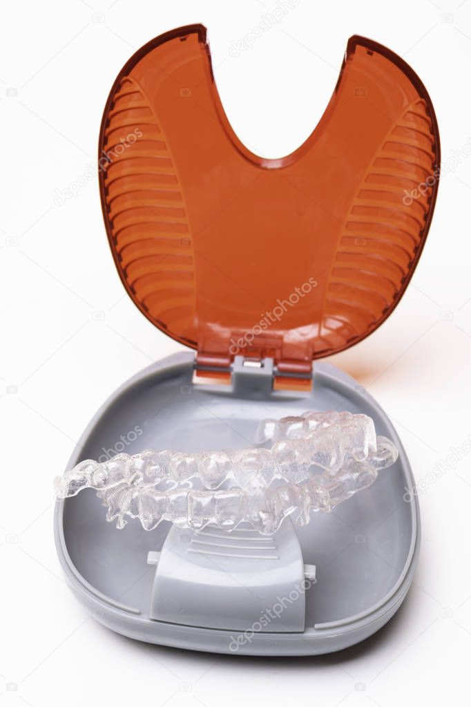 Isolated transparent teeth prosthesis aligner with its box, A way to have a beautiful smile
