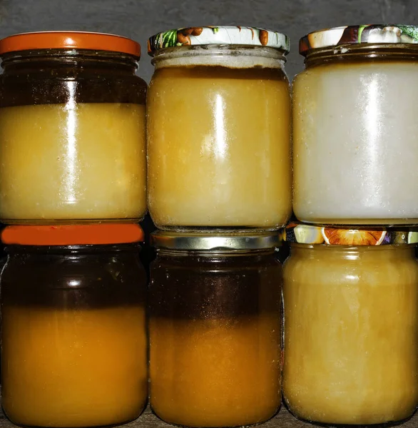 Jars Different Honey Varieties Shelf White Yellow Orange Tipes — Stock Photo, Image