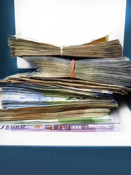 euro money banknotes, pile of money, cash, stack, new bills, isolated on blue background