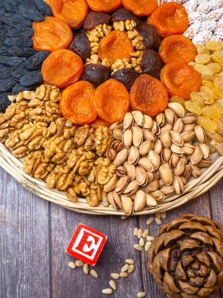 Tocopherol rich food Mix of nuts and dried apricots. Gold pistachios, almonds, raisin, cedar nuts, walnuts Food background food rich in E vitamin