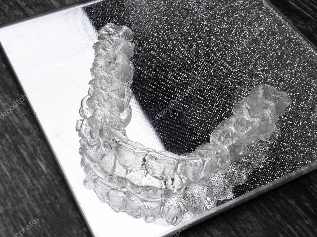 Inivisalign braces or aligner. A way to have a beautiful smile and white teeth.
