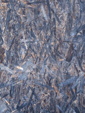 OSB tahtaları ahşap bir zemine zımparalanmış kahverengi odun parçalarından yapılmıştır. OSB ahşap kaplama arka planının üst görünümü, sıkı, pürüzsüz yüzeyler.