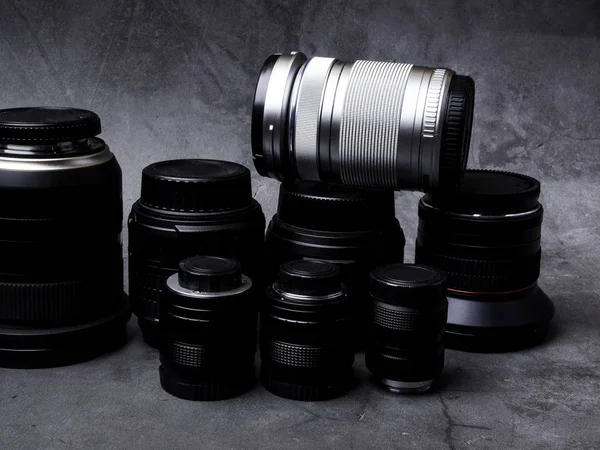 Collection of camera lens on grey background — Stock Photo, Image