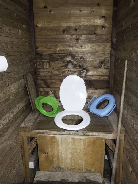 Garden toilet in rustic style is made of wooden boards. — Stock Image Garden toilet in rustic style is made of wooden boards. Royalty Free Stock Photos