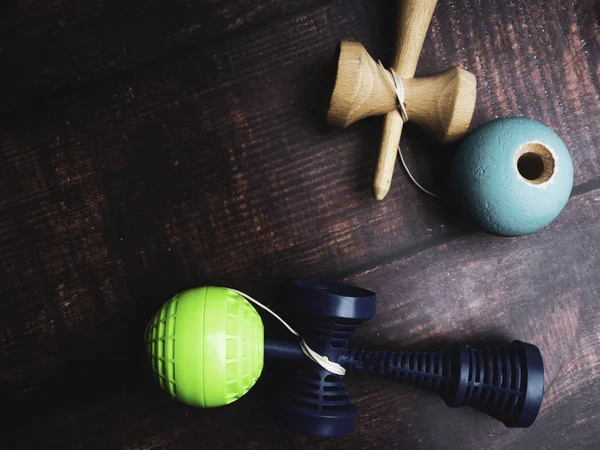 Traditional Japanese wood toy Kendama on wooden background, Symbol of Japanese boy toy.