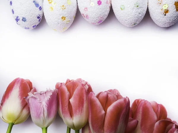 Easter decorative color eggs on white background. Top view — Stock Photo, Image