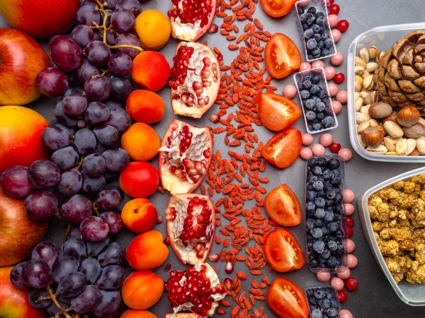 Superfoods, fruits, pomegranate seeds, nuts, resveratrol, antioxidants, vitamin food, for vegan and vegetarian eating. Clean eating. Detox, dieting food concept. Banner.