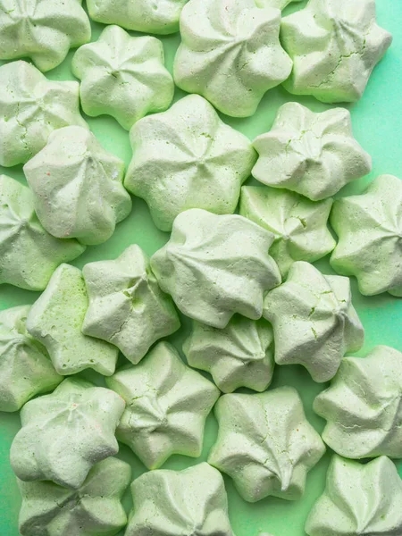 Mint green meringues over mint backdrop with copy space — Stock Photo, Image