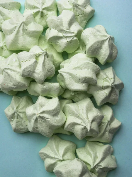 mint green meringues over mint backdrop with copy space