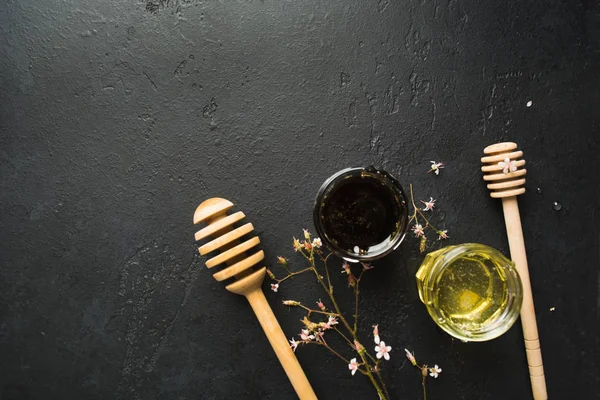 Two type of healthy organic natural honey with spoons and small