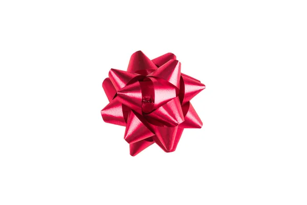 Pink paper holiday bow over white isolated background. Single object. Mockup. Top view — Stock Photo, Image