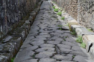 Stone sidewalk and gray curbs