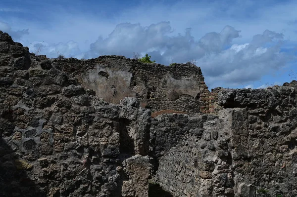 Blue sky and thick clouds over the ruins of the city