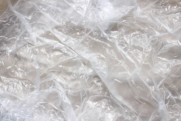 Temiz plastik torba doku arka plan. Atık geri dönüşüm konsepti. Buruşturulmuş polietilen ve selofan.