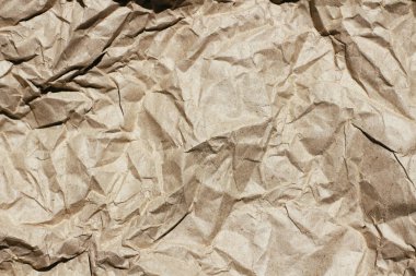 Buruşuk kahverengi zanaat kağıt doku arka plan. Paket ambalajı. Eski ambalaj kağıdı. Pişirme parşömeni.