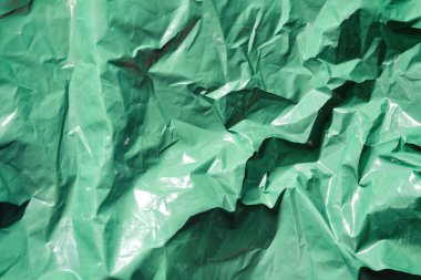 Yeşil plastik çöp torbası doku arka plan. Atık geri dönüşüm konsepti.