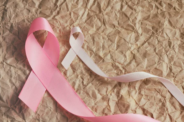 Pink ribbon. Symbol of breast cancer awareness. Health care conception. Preventive measures. October checking time. Woman`s health.