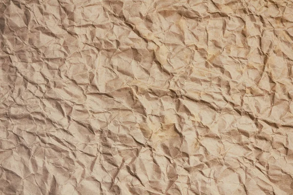 Kırışmış Açık Kahverengi Işi Kağıt Dokusu Arka Planı Paket Ambalajı — Stok fotoğraf