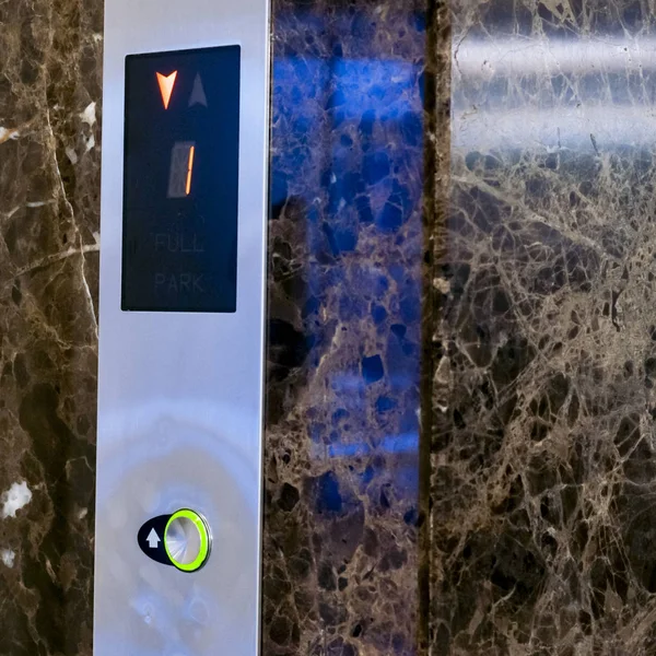 Elevator Button up and down direction. Screen with floor number. Elevator driving direction. Selective focuse.