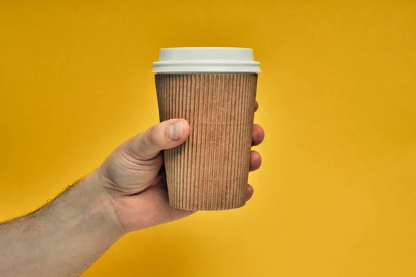 Hand holding paper cup from yellow torn paper Stock Photo by ©5seconds ...