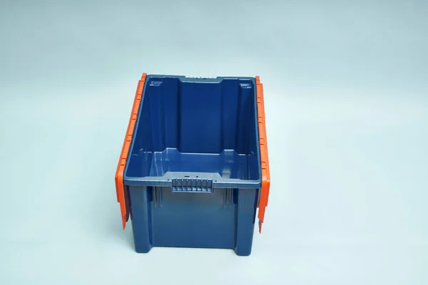 Plastic storage boxes. Boxes for the delivery of products. Orderly storage.