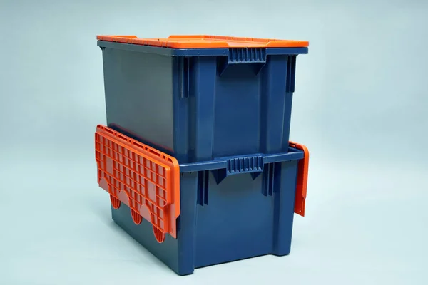 Plastic storage boxes. Boxes for the delivery of products. Orderly storage.