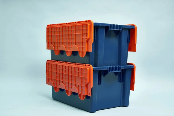 Plastic storage boxes. Boxes for the delivery of products. Orderly storage.