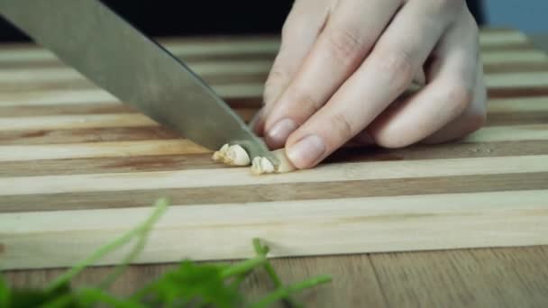 Woman Hands Cutting Garlic Chopping Board Kitchen Close — Stock Video