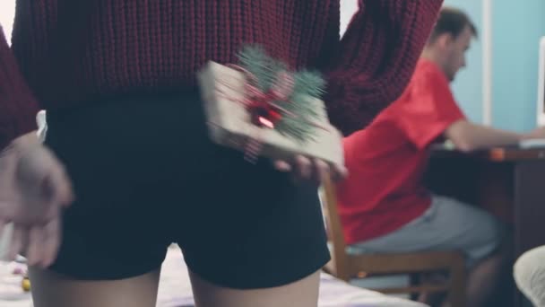 Loving Woman Hiding Christmas Gift Box Her Back Surprising Her — Stock Video