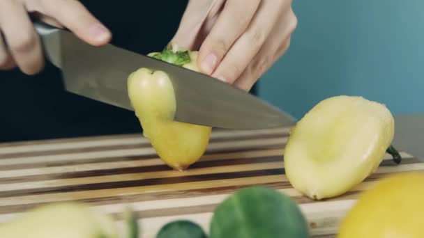 Knife Cuts Yellow Pepper Slicing Sweet Pepper Wooden Cutting Board — Stock Video