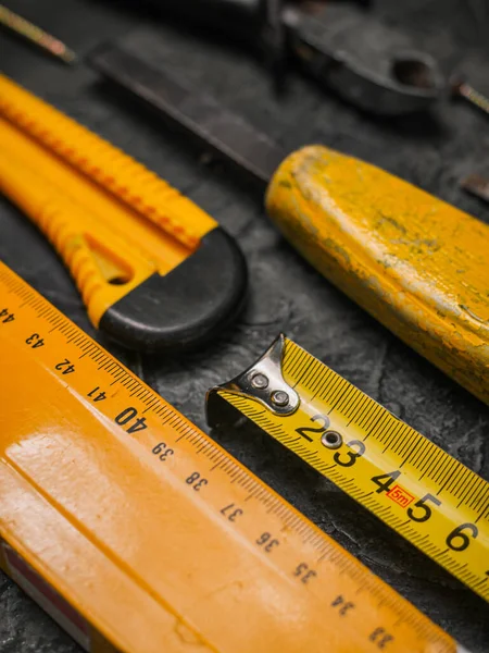 Background of various construction tools. Building tools repair set on black background.