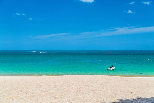 The ocean is turquoise and the boat is far away. Thailand. Samui