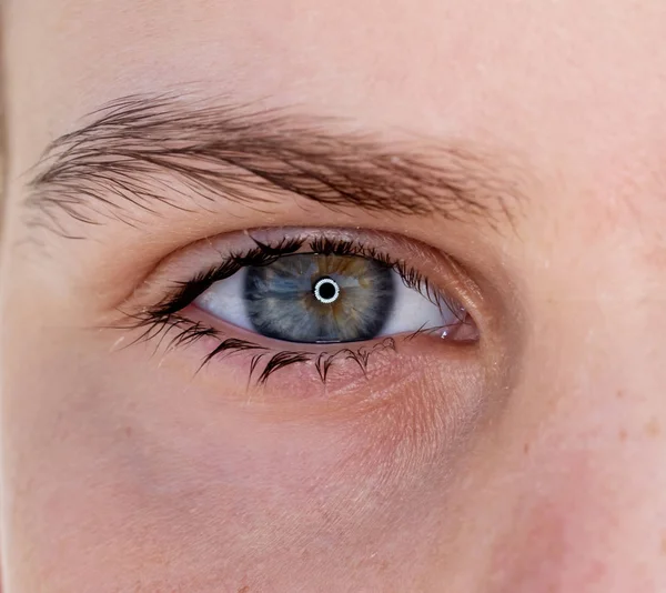 One eye of a teenager macro close-up — Stock Photo, Image