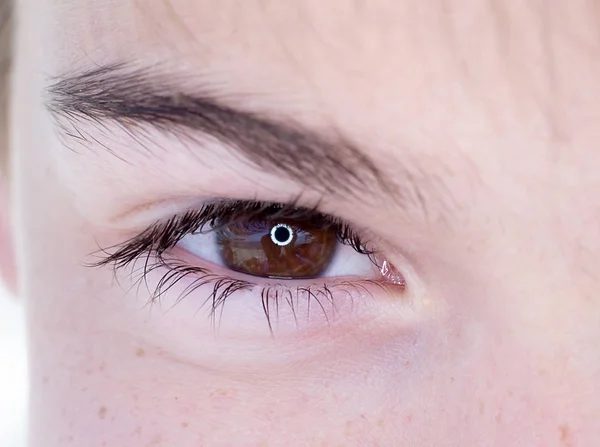 One eye of a teenager macro close-up — Stock Photo, Image