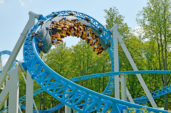 Saint-Petersburg.Russia. July.15.2018. Kresovsky island.Divo island Park.A popular attraction is the Russian roller coaster.It is a railway system of special design.Passengers traveling in railcar at high speed.