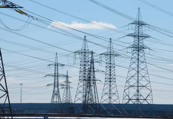 Electric current transmission line.Designed for power transmission.It takes place in the under construction area of the city.