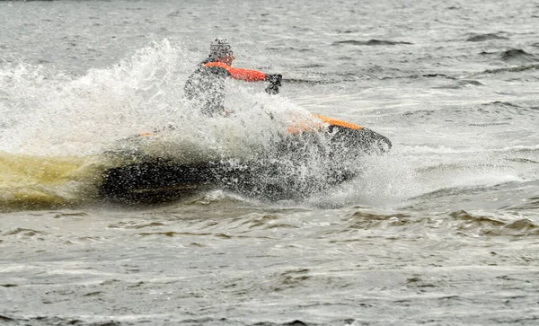 Fast scooter ride on the sea.When you turn the boat flying spray of water.