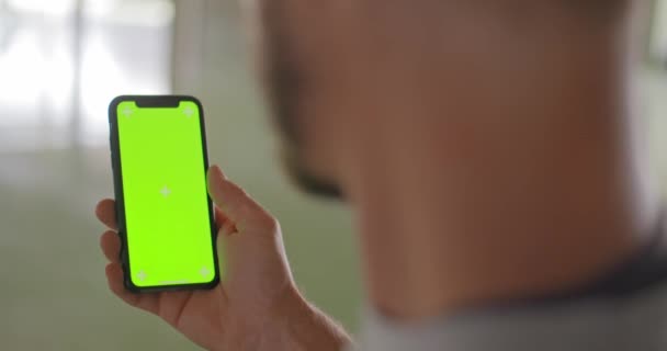 Young adult man using smartphone with green screen during fitness sport workout .Grunge industrial urban training.4k slow motion video — Stock Video