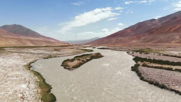 Aerial over Panji river and arid desert mountains.Pamir highway silk road trip adventure in Kyrgyzstan and Tajikistan desert region,central Asia.4k drone flight establisher video — Stock Video