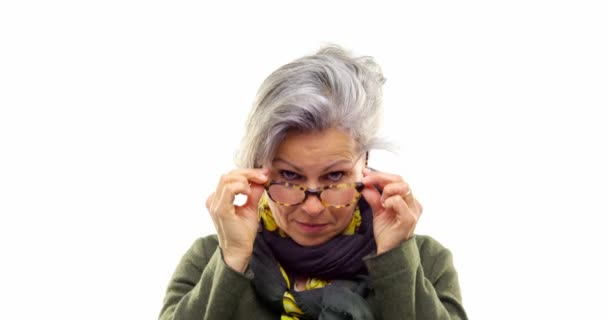 Beautiful white hair adult woman serious, happy, smiling, putting on and getting of eyeglasses.Person action.People video portrait isolated on white background.Medium shot.4k video — стоковое видео