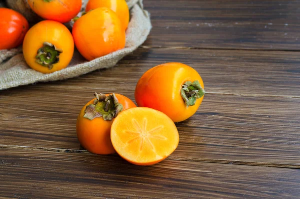 Fresh Organic Persimmon Fruit Cut Half Rustic Wood Background — Stock Photo, Image