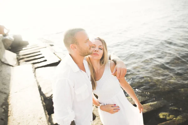 Fashion model couple with tattoo posing outside nea sea — Stock Photo, Image