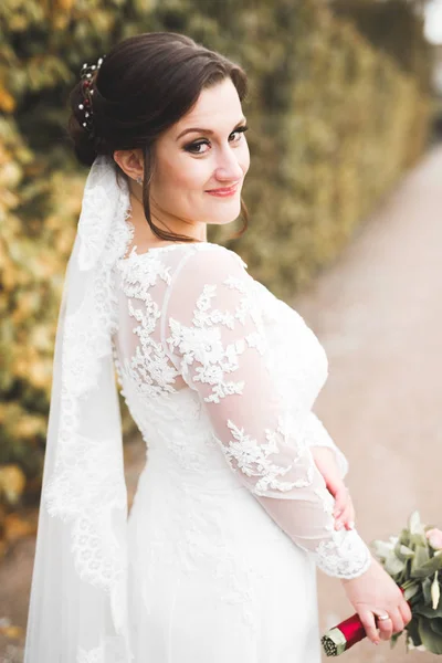 Beautiful luxury bride in elegant white dress — Stock Photo, Image