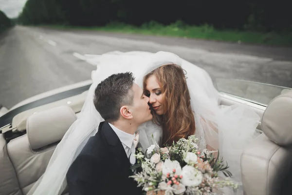 Happy bride and groom posing after wedding ceremony — Stock Photo, Image