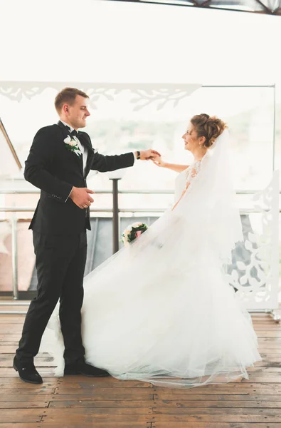 Beautiful bride and groom spinning with perfect dress — Stock Photo, Image