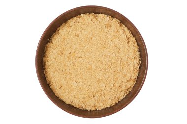 Ahşap kase beyaz arka plan üzerinde izole beslenme bira Maya flakes. Üstten görünüm