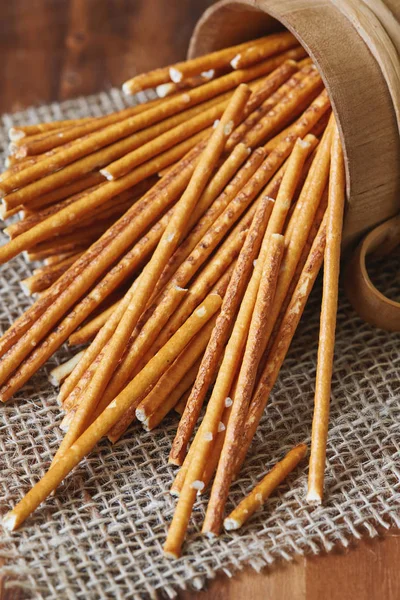 Group of salted pretzel sticks scattered around the table