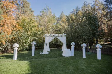 arch for the wedding ceremony in fall in the park