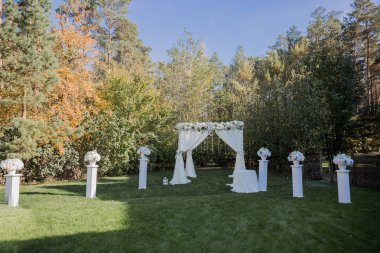 arch for the wedding ceremony in fall in the park