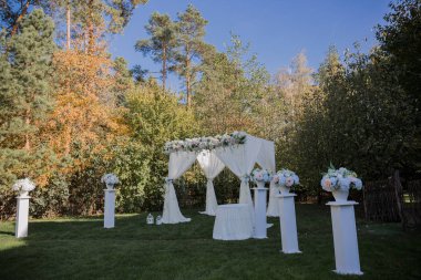 arch for the wedding ceremony in fall in the park